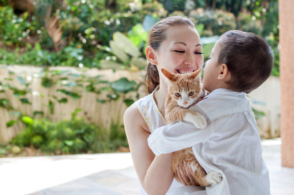 Woman and child with cat