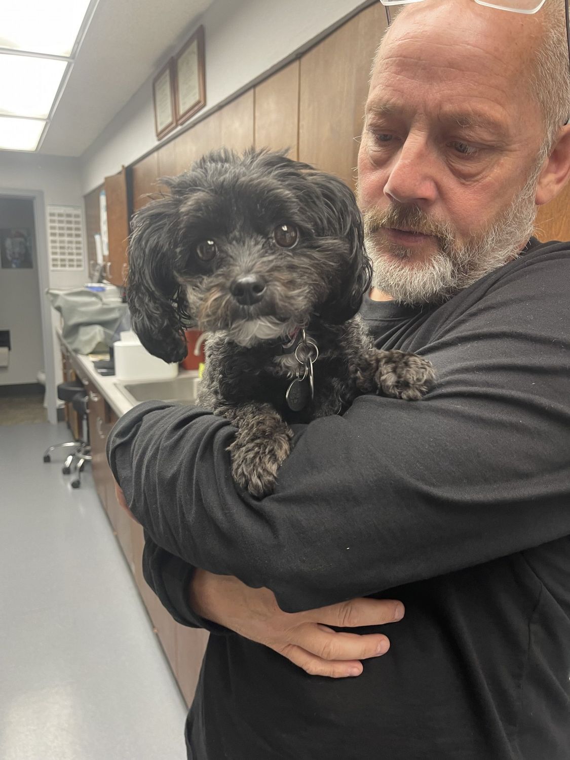 man holding pet